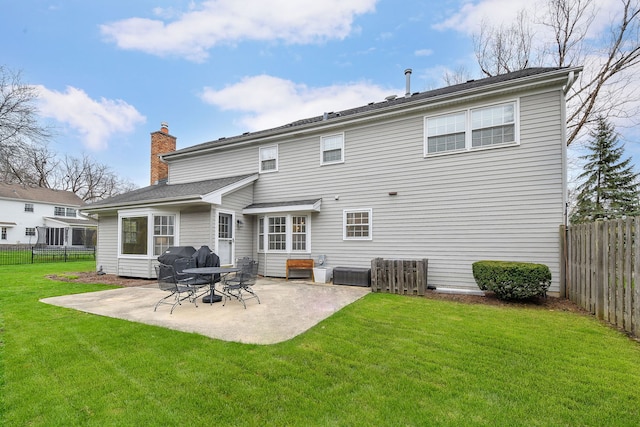 1007 Canonero Dr, Naperville, IL 60540 - rear view of house featuring a trampoline, a patio area, a fenced backyard, and a lawn