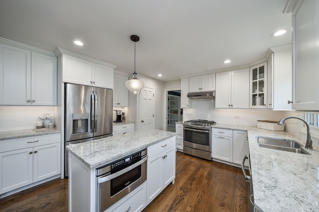 1007 Canonero Dr, Naperville, IL 60540 - kitchen with a sink, decorative backsplash, white cabinetry, and stainless steel appliances