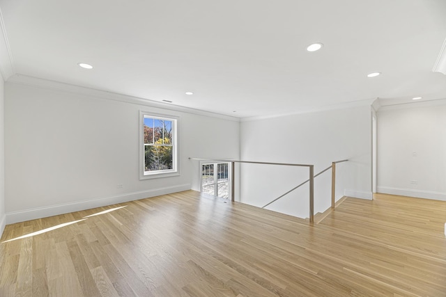 interior space with recessed lighting, light wood-style floors, baseboards, and ornamental molding