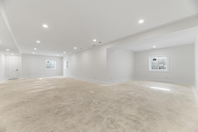 below grade area featuring baseboards and recessed lighting