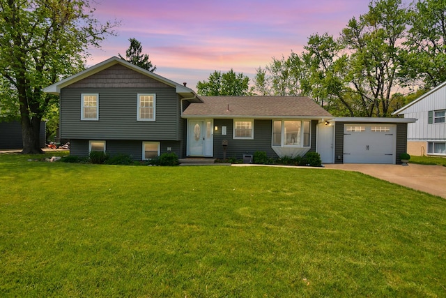 1603 Aurora Way, Normal, IL 61761 - split level home with driveway, an attached garage, and a front lawn