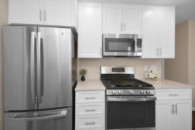 1603 Aurora Way, Normal, IL 61761 - kitchen featuring appliances with stainless steel finishes, white cabinets, and light stone countertops