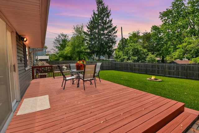 1603 Aurora Way, Normal, IL 61761 - deck at dusk featuring outdoor dining space and a fire pit