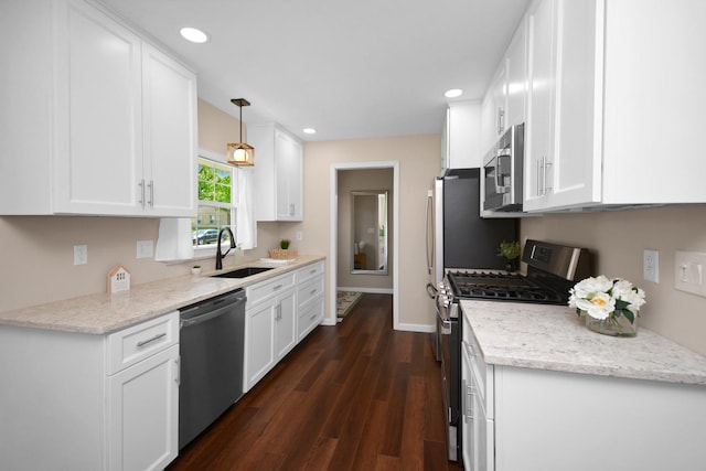 1603 Aurora Way, Normal, IL 61761 - kitchen with stainless steel appliances, a sink, dark wood-type flooring, white cabinets, and recessed lighting