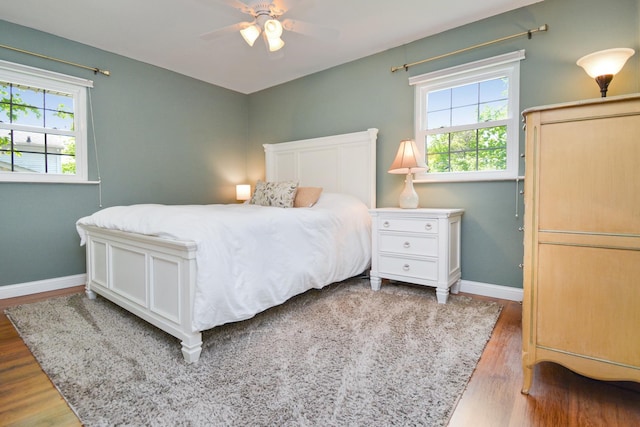1603 Aurora Way, Normal, IL 61761 - bedroom with wood finished floors, baseboards, and a ceiling fan
