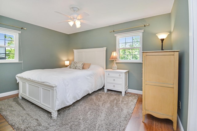 1603 Aurora Way, Normal, IL 61761 - bedroom featuring wood finished floors, multiple windows, baseboards, and ceiling fan