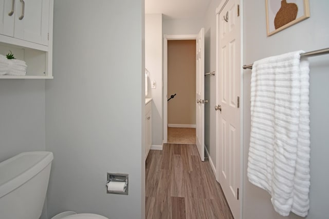 1603 Aurora Way, Normal, IL 61761 - bathroom featuring wood finished floors, toilet, baseboards, and vanity