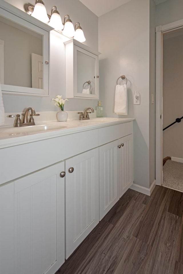1603 Aurora Way, Normal, IL 61761 - bathroom featuring wood finished floors, double vanity, and baseboards