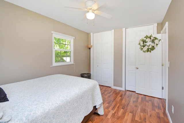 1603 Aurora Way, Normal, IL 61761 - bedroom featuring multiple closets, wood finished floors, ceiling fan, and baseboards