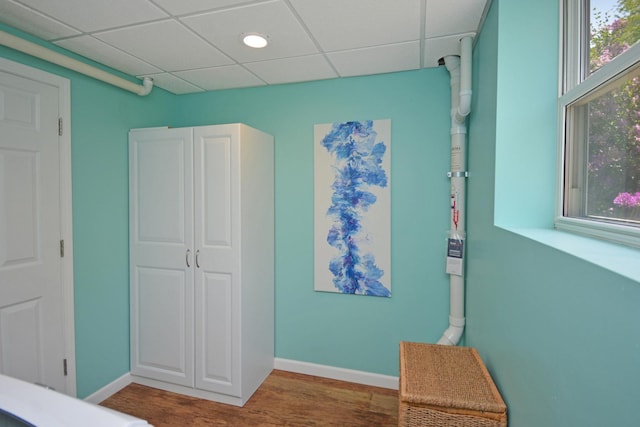 1603 Aurora Way, Normal, IL 61761 - unfurnished bedroom with wood finished floors, a paneled ceiling, and baseboards
