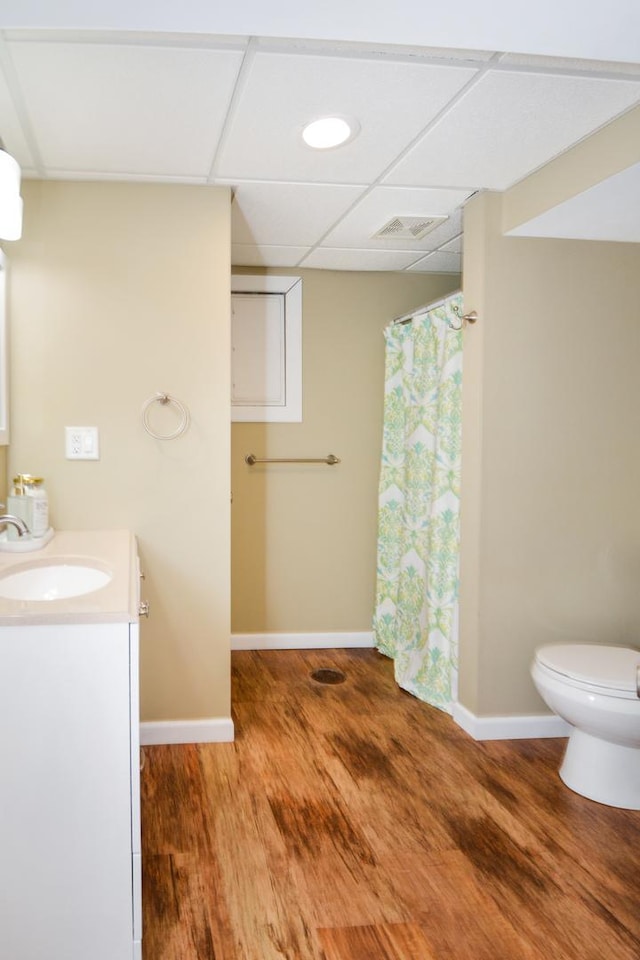 1603 Aurora Way, Normal, IL 61761 - bathroom with wood finished floors, baseboards, toilet, vanity, and a drop ceiling