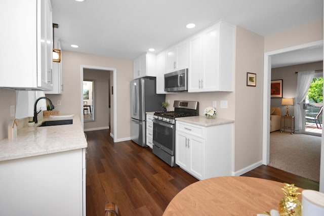 1603 Aurora Way, Normal, IL 61761 - kitchen with stainless steel appliances, a sink, white cabinetry, baseboards, and recessed lighting