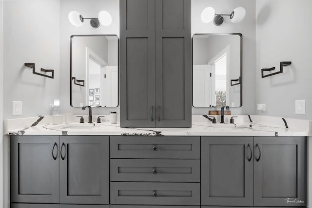 bathroom with double vanity and a sink