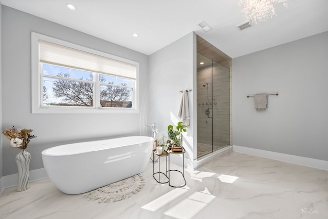 bathroom with visible vents, a freestanding tub, a stall shower, marble finish floor, and recessed lighting