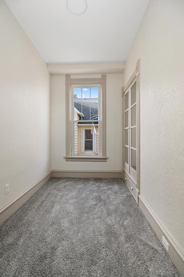 505 S Indiana Ave, Kankakee, IL 60901 - carpeted spare room featuring a textured wall