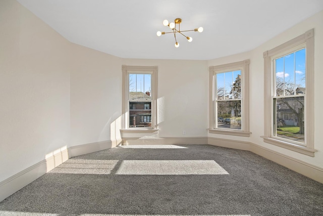 505 S Indiana Ave, Kankakee, IL 60901 - empty room with a chandelier, carpet, and baseboards