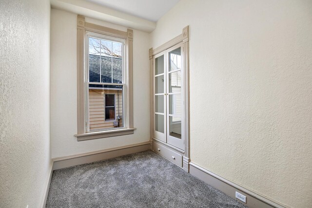 505 S Indiana Ave, Kankakee, IL 60901 - unfurnished room featuring a textured wall and carpet