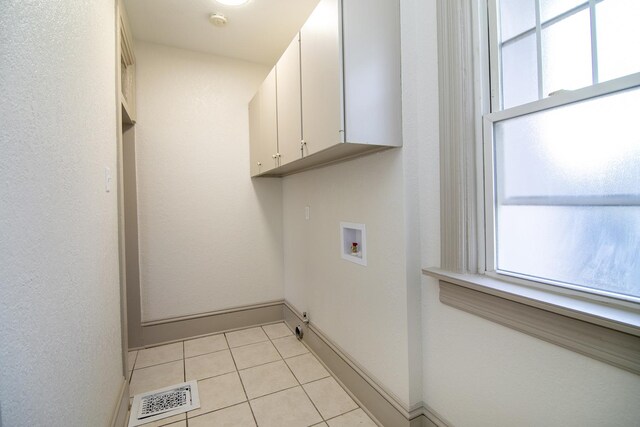 505 S Indiana Ave, Kankakee, IL 60901 - clothes washing area with plenty of natural light, visible vents, hookup for a washing machine, and cabinet space