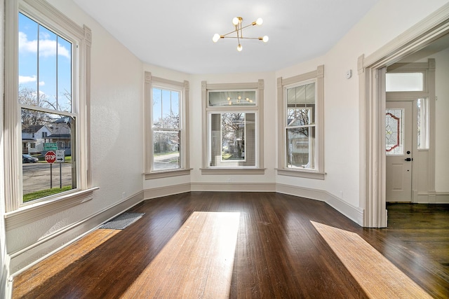 505 S Indiana Ave, Kankakee, IL 60901 - interior space featuring visible vents, baseboards, a chandelier, and dark wood-style floors