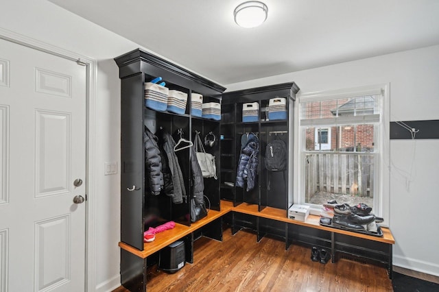 mudroom with baseboards and wood finished floors