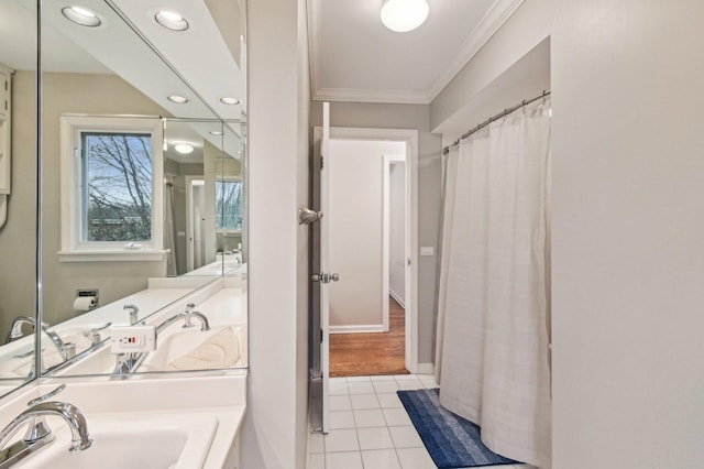 bathroom featuring crown molding, recessed lighting, a sink, and tile patterned flooring