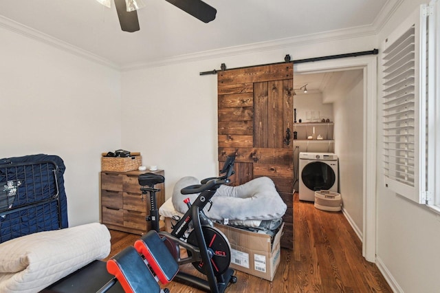 sitting room featuring a ceiling fan, washer / clothes dryer, wood finished floors, and ornamental molding