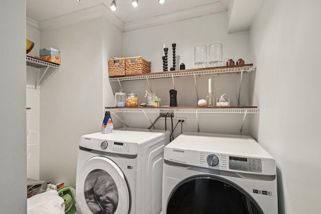 laundry room featuring independent washer and dryer, laundry area, and ornamental molding