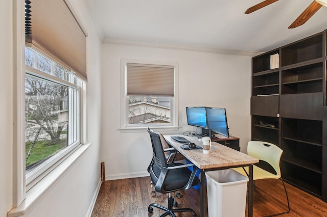 home office featuring crown molding, a ceiling fan, baseboards, and wood finished floors
