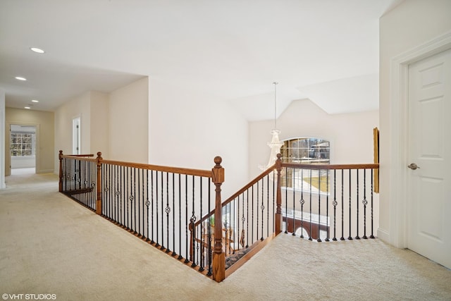 hallway featuring carpet floors, recessed lighting, and a healthy amount of sunlight