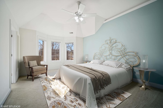 bedroom featuring visible vents, baseboards, ceiling fan, carpet floors, and lofted ceiling