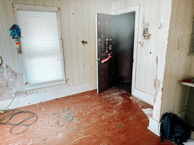 foyer with wallpapered walls
