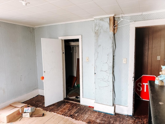 interior space featuring dark wood-type flooring and crown molding
