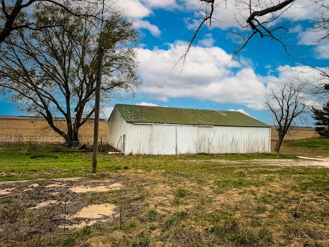 view of pole building with a yard