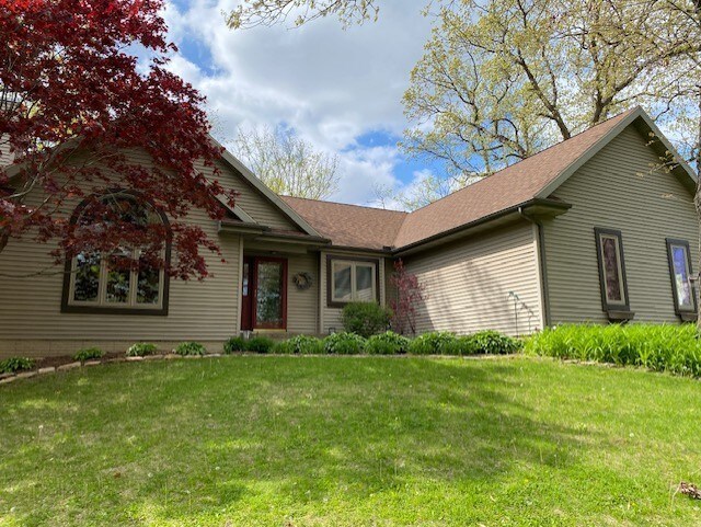 130333020 E St, Spring Valley, IL 61362 - view of front of home featuring a chimney, a front yard, and a shingled roof