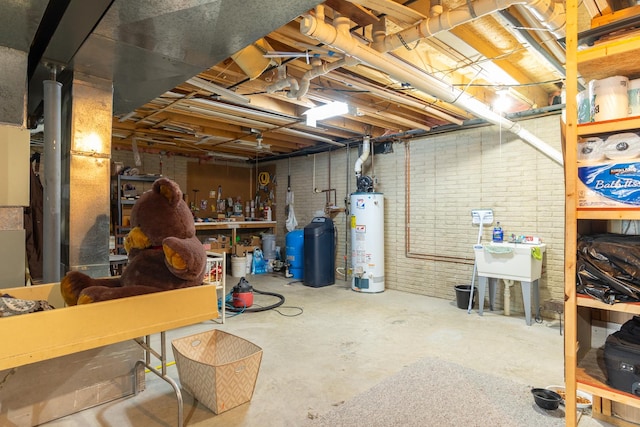unfinished basement featuring water heater and brick wall