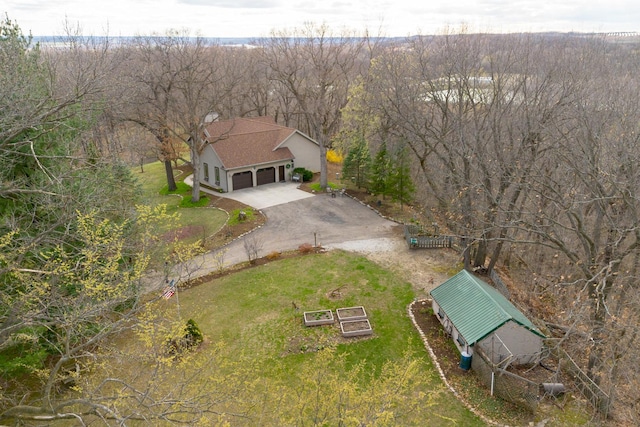 view of subject property with a heavily wooded area