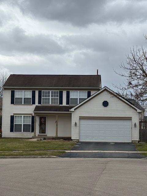 678 Meridian Way, Antioch, IL 60002 - view of front facade featuring an attached garage, driveway, a front yard, and fence