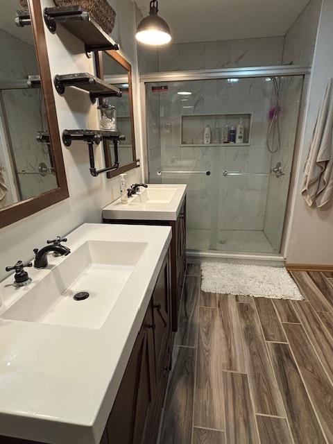 678 Meridian Way, Antioch, IL 60002 - bathroom featuring vanity, a stall shower, and wood tiled floor