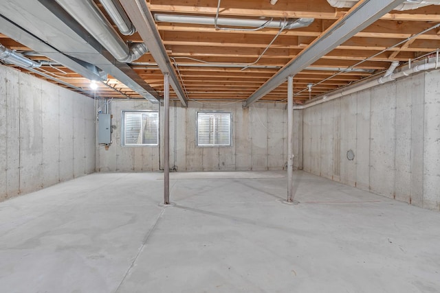 basement featuring electric panel