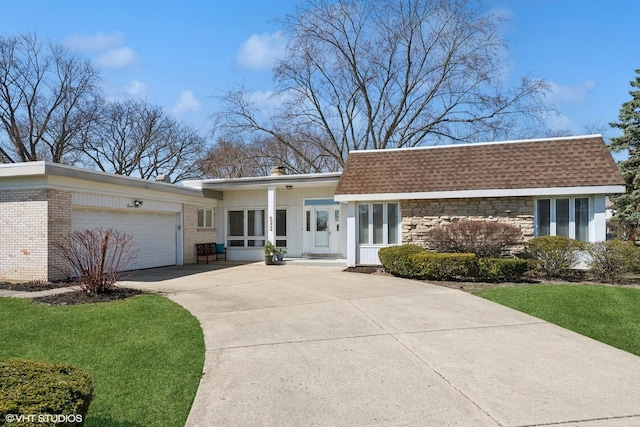 1130 Crestwood Dr, Northbrook, IL 60062 - view of front of home featuring roof with shingles, driveway, an attached garage, and a front lawn