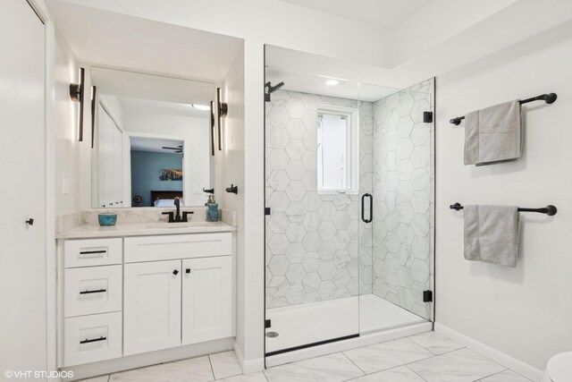 1130 Crestwood Dr, Northbrook, IL 60062 - bathroom featuring marble finish floor, vanity, baseboards, and a stall shower