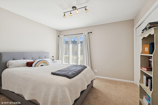1130 Crestwood Dr, Northbrook, IL 60062 - carpeted bedroom with baseboards and rail lighting
