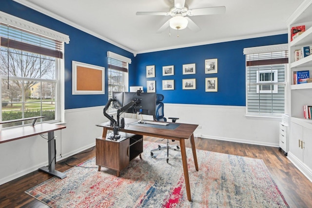 home office featuring a healthy amount of sunlight, a ceiling fan, ornamental molding, and wood finished floors