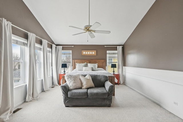 bedroom with visible vents, carpet flooring, a ceiling fan, and lofted ceiling