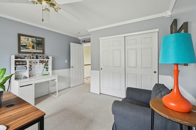 sitting room with crown molding, a ceiling fan, and light carpet