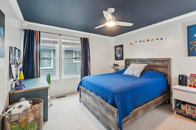 carpeted bedroom with visible vents, ornamental molding, and a ceiling fan