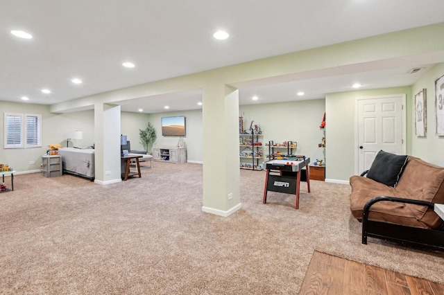 carpeted living area with recessed lighting, visible vents, and baseboards