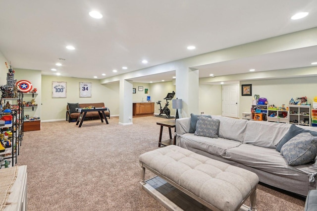 living area with baseboards, recessed lighting, and light carpet