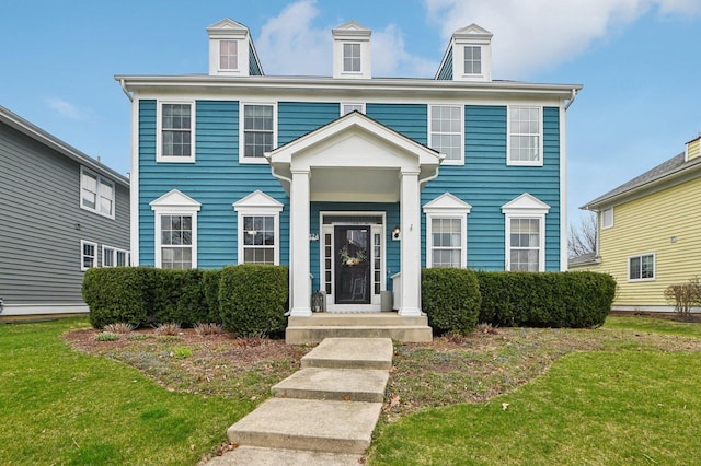 view of front of home featuring a front yard