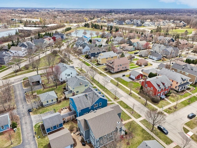 birds eye view of property featuring a water view and a residential view